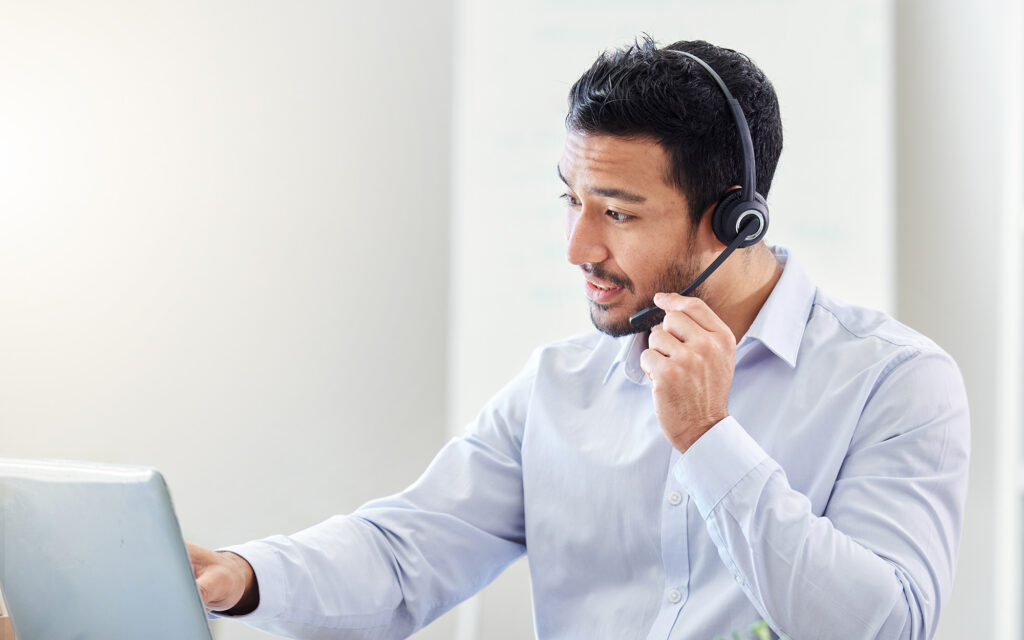 Side view of man on headset